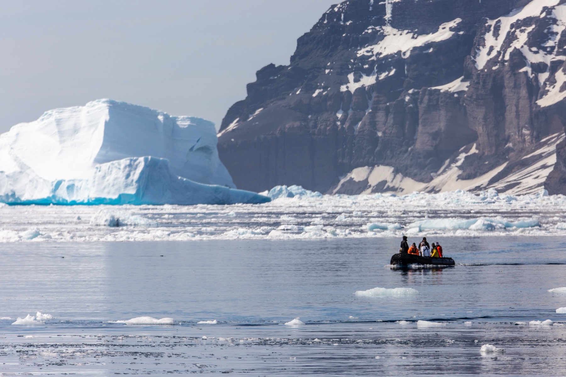 Zodiac among icebergs in Svalbard