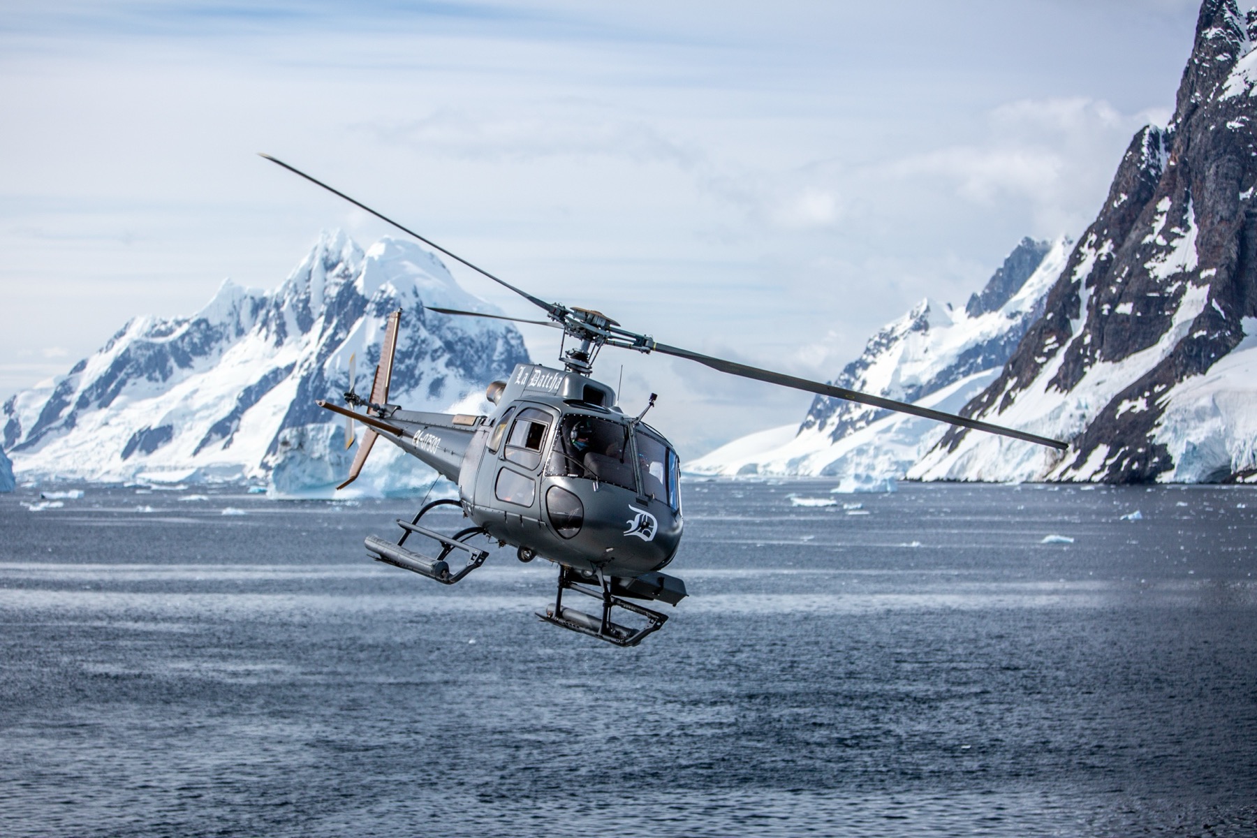 Helicopter in flight over the polar ice
